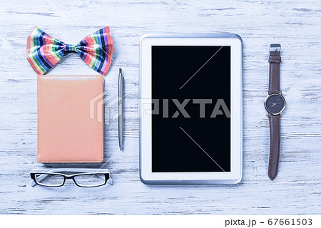 Gentleman kit of tablet watch glasses bow tie and notebook on wo 67661503