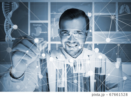 Portrait of concentrated male scientist working with reagents in laboratory 67661528