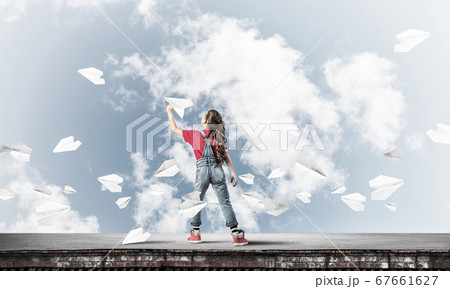 Concept of careless happy childhood with girl dreaming to become pilot Concept of careless happy childhood with girl dreaming to become pilot 67661627