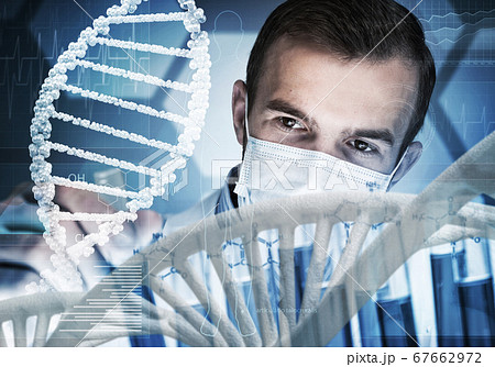 Young scientist mixing reagents in glass flask in clinical laboratory 67662972