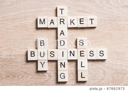 Conceptual business keywords on table with elements of game making crossword 67662973