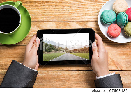 Businesswoman having coffee break 67663485