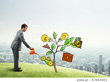Young businessman outdoors watering drawn growth concept with can 67664001