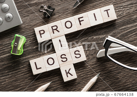 Conceptual business keywords on table with elements of game making crossword 67664138