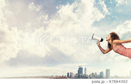Girl screaming in loudspeaker Girl screaming in loudspeaker 67664302
