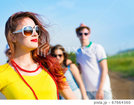 stylish young woman in sunglasses stylish young woman in sunglasses 67664360