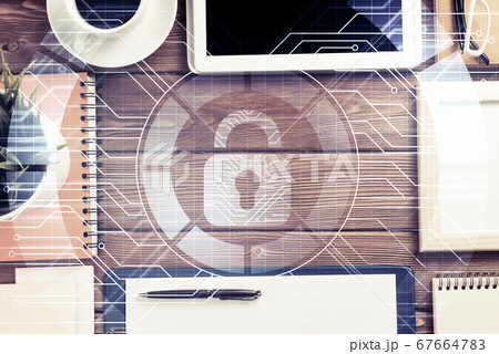 Business workplace with tablet pc and security concept on screen Business workplace with tablet pc and security concept on screen 67664783