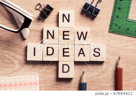 Conceptual business keywords on table with elements of game making crossword 67664812