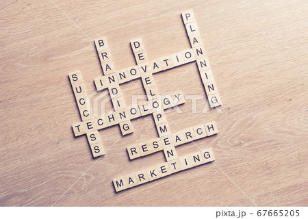 Conceptual media keywords on table with elements of game making crossword Conceptual media keywords on table with elements of game making crossword 67665205