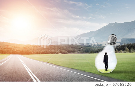 Businessman inside light bulb 67665520