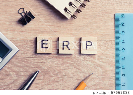 Enterprise Resource Planning concept spelled on table with wooden elements 67665858