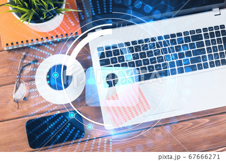 Business workplace with laptop coffee cup and security concept on screen 67666271