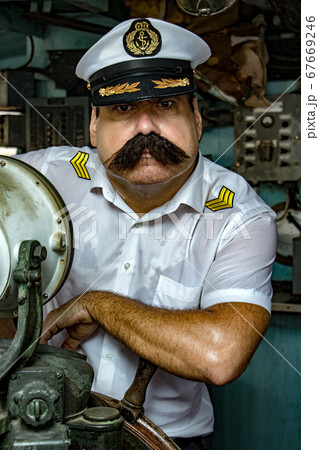 A sailor officer - old salt in the uniform is A sailor officer - old salt in the uniform is 67669246
