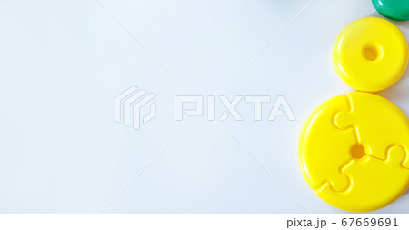 Colorful details of the children's pyramid. round toy on a white background. Concept of motor skills development, educational games, childhood, children's day, kindergarten, house arrest copyspace Colorful details of the children's pyramid. round toy on a white background. Concept of motor skills development, educational games, childhood, children's day, kindergarten, house arrest copyspace 67669691