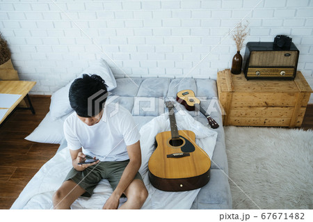 Smartphone, guitar and ukulele. 67671482