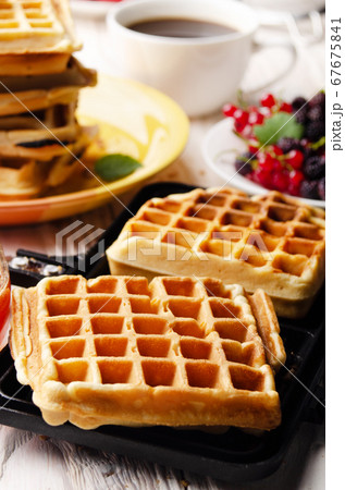 Belgian waffles on cast skillet with stacked ones Belgian waffles on cast skillet with stacked ones 67675841
