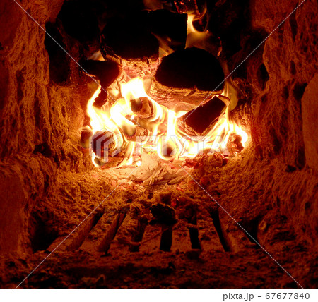 Beautiful red fire from slice wood, dark grey Beautiful red fire from slice wood, dark grey 67677840