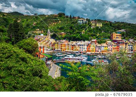 Famous Portofino village with touristic boats in harbor, Liguria, Italy Famous Portofino village with touristic boats in harbor, Liguria, Italy 67679035