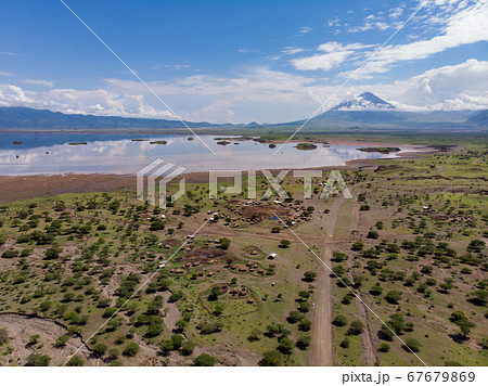 Aerial view of Maasai boma or family rural village on the coast of Salty lake Natron in the Great Rift Valley, Tanzania Aerial view of Maasai boma or family rural village on the coast of Salty lake Natron in the Great Rift Valley, Tanzania 67679869