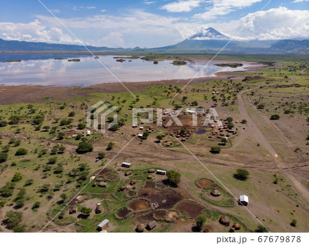 Aerial view of Maasai boma or family rural village on the coast of Salty lake Natron in the Great Rift Valley, Tanzania Aerial view of Maasai boma or family rural village on the coast of Salty lake Natron in the Great Rift Valley, Tanzania 67679878