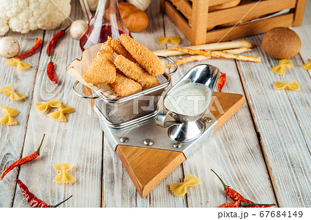 Breaded fried tender mozzarella with tartar sauce Breaded fried tender mozzarella with tartar sauce 67684149
