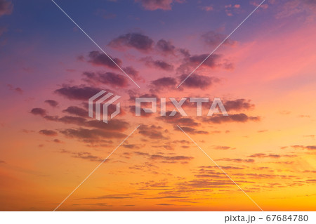 Dramatic colorful red purple to blue sunset or sunrise sky landscape. Natural beautiful cloudscape dawn background wallpaper. Stormy windy nature twilight dusk scene panorama 67684780