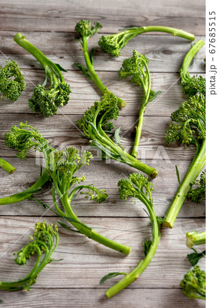 Top view of broccolini inflorescences on wooden background Top view of broccolini inflorescences on wooden background 67685515