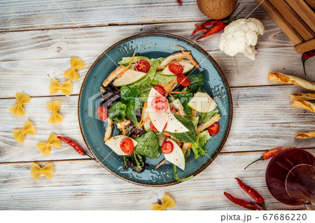 Gourmet salad with turkey apple greens vegetables 67686220