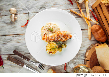Gourmet dish grilled salmon steak potato gratin Gourmet dish grilled salmon steak potato gratin 67687944