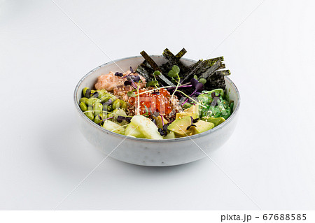 Isolated asian poke bowl with avocado roe nori  67688585
