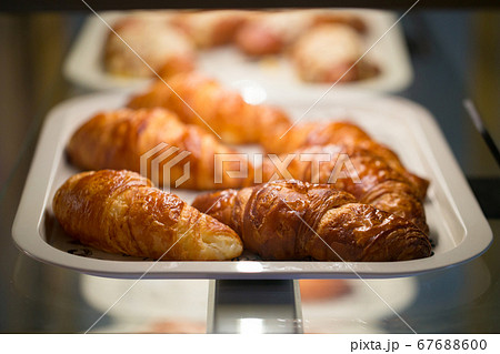 Selective focus on croissants on a white tray 67688600
