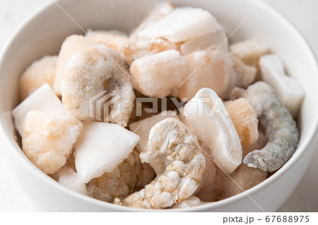 frozen seafood in white bowl 67688975