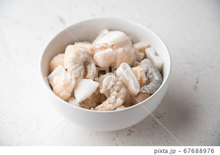 frozen seafood in white bowl 67688976