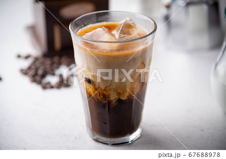 iced coffee with milk and dripping tools 67688978