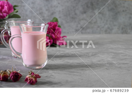 Rose moon milk and dry roses on grey. Copy space. Rose moon milk and dry roses on grey. Copy space. 67689239