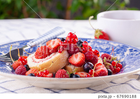 dessert with fresh berries in a blue vintage dessert with fresh berries in a blue vintage 67690188