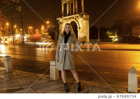 Beautiful Young Woman In A City At Night 67690734