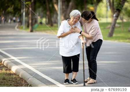 Old elderly with short of breath and chest pain from heart disease, heart attack or heart failure while walking to exercise in outdoor at the park,senior woman with illness,symptoms of dyspnea,angina Old elderly with short of breath and chest pain from heart disease, heart attack or heart failure while walking to exercise in outdoor at the park,senior woman with illness,symptoms of dyspnea,angina 67699150