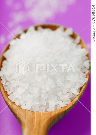 Sea salt crystals close-up in macro mode on a pink 67699914