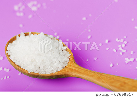 Sea salt crystals close-up in macro mode on a pink 67699917