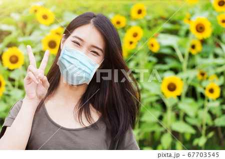 girl teen with face mask protect Coronavirus(Covid-19) or Air pollution or flower pollen allergy 67703545