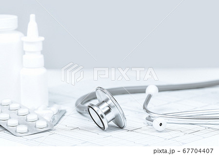 Background of white tablets or pills on the table. Background of white tablets or pills on the table. 67704407