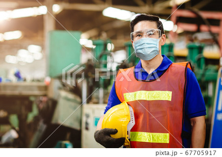 Asian Worker wear disposable face mask for protection Corona Virus and Smoke dust air pollution 67705917