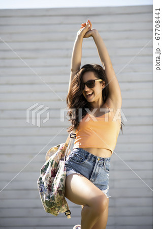 Pretty brunette girl in shorts feeling amazing 67708441