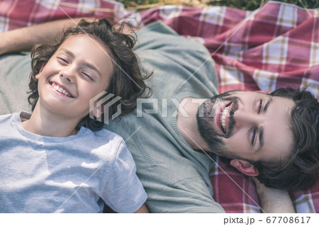 Dad and son enjoying the day together 67708617