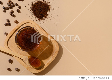 Coffee beans and homemade natural scrub for anti cellulite procedure. Zero waste, eco friendly on beige background. 67708814