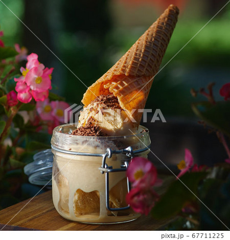 Vanilla ice cream in glass jars  67711225