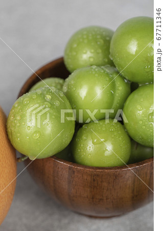 Cherry plums in the bowl with water drops on them 67711346