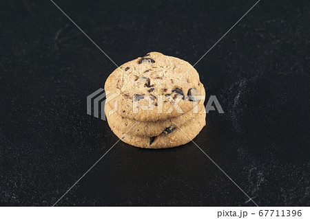 Butter and chocolate cookies on a wooden board 67711396