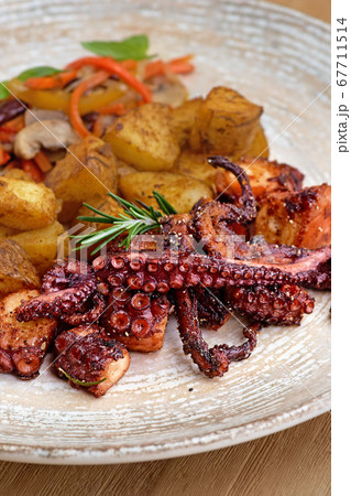 grilled octopus dish with small potatoes grilled octopus dish with small potatoes 67711514